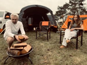 Olpro campervan awning and tent pitched outdoors, lifestyle banner for Olpro discount codes