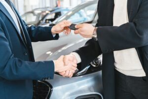 Traveller handing car keys to a Maple Parking Meet and Greet driver at the airport terminal
