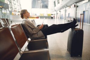 Travellers relaxing with food and drinks in a No1 Lounge airport lounge