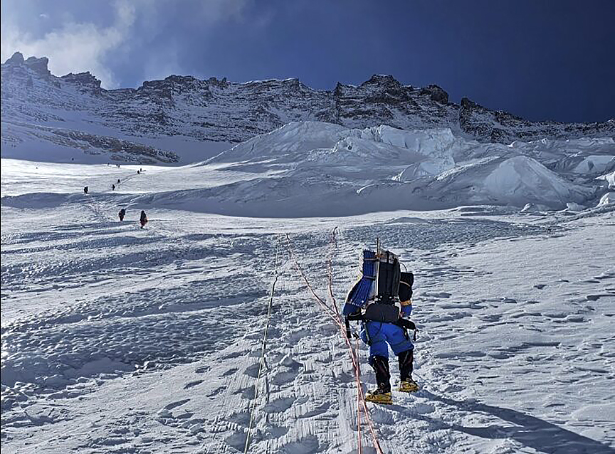 climbers on fixed ropes on Lhotse Face route toward Camp 3 Everest Nepal