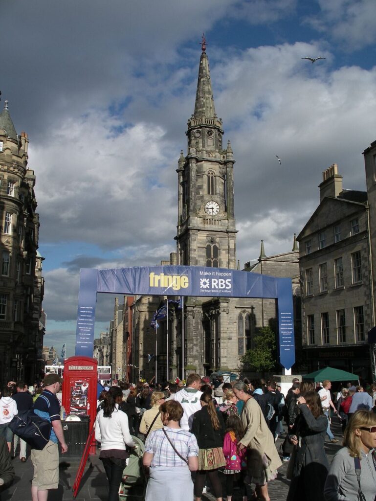 Crowds on Edinburgh's Royal Mile by the Tron Kirk during the Fringe festival