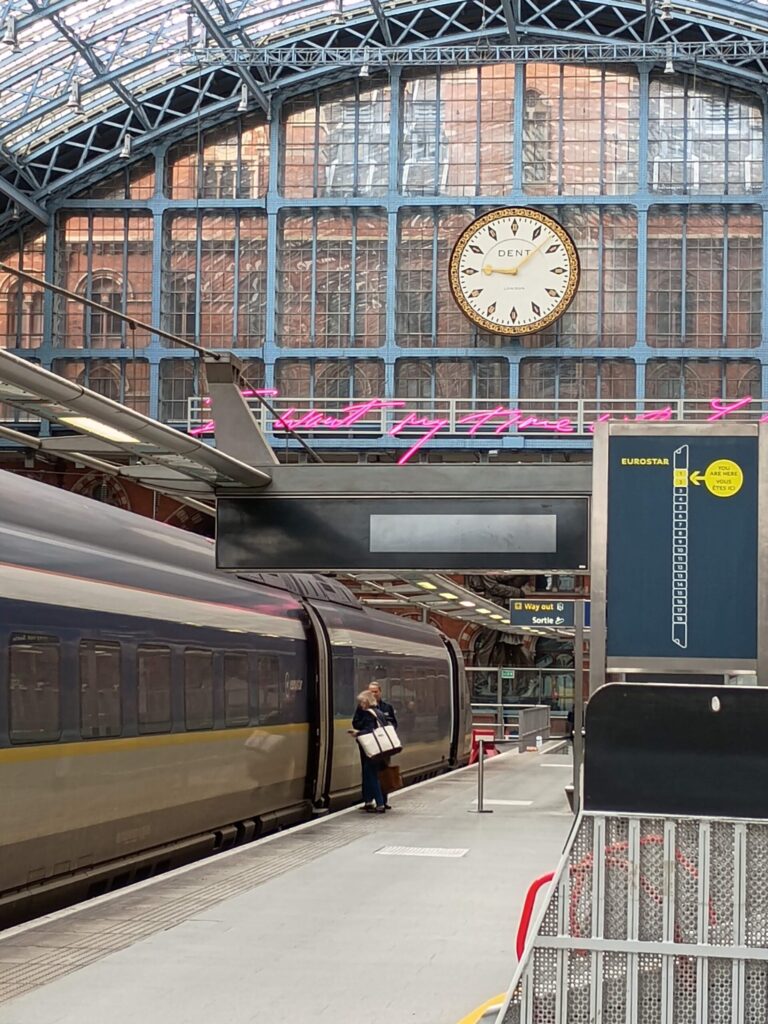 Eurostar train at St Pancras International platform with iconic Dent clock trainshed June 2026