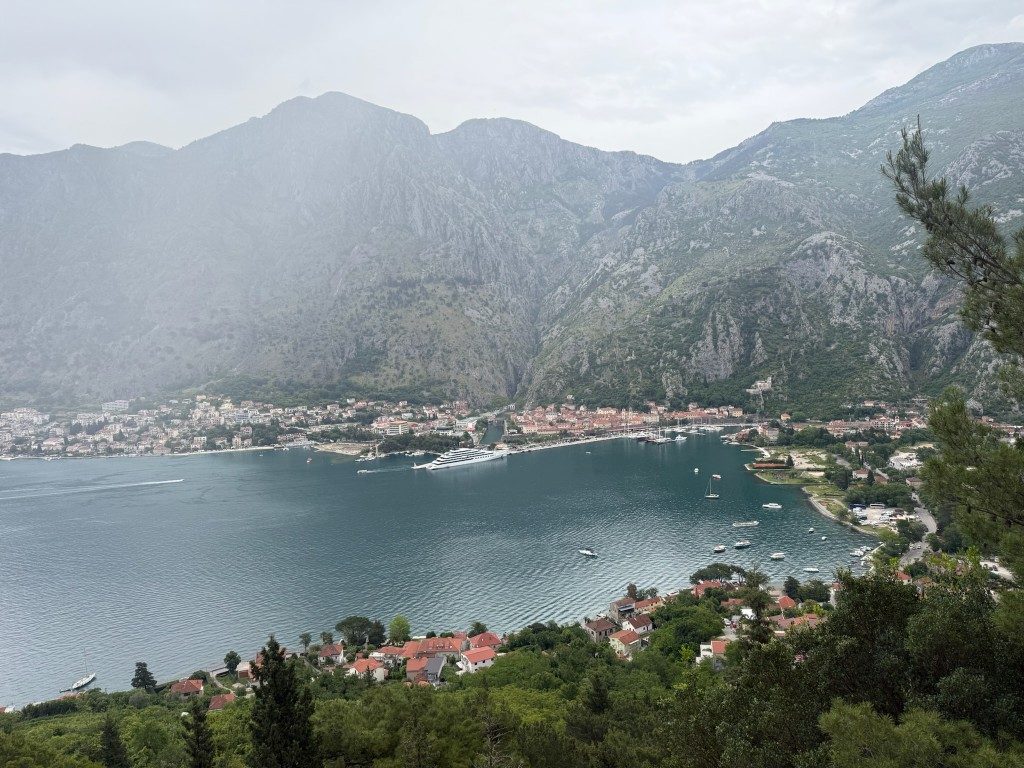 Kotor Viewpoint Hike | Kotor Viewpoint Hike | Kotor Walk Guide & Viewpoints Hazy view of Kotor rooftops and the bay from the descent