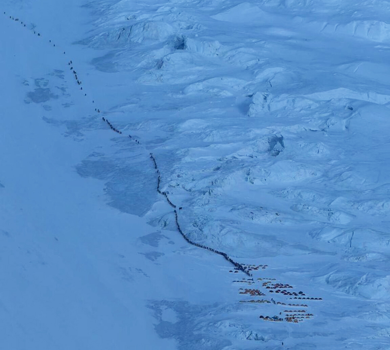long queue of climbers ascending Everest Nepal south col route May 2026