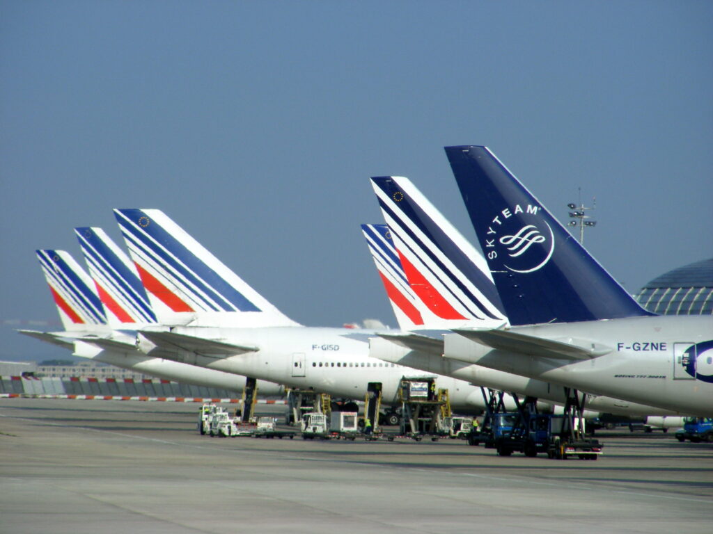 Row of Air France aircraft tails parked on the apron at Paris Charles de Gaulle