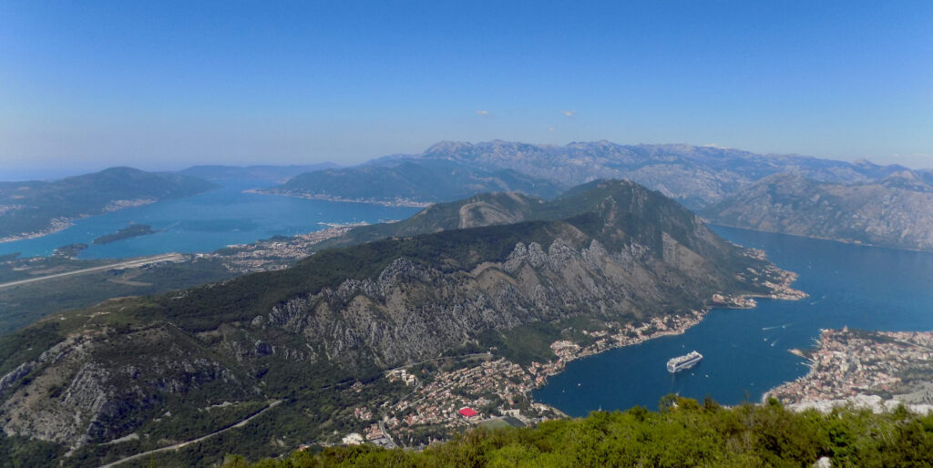 Cruise ship anchored in the Bay of Kotor Montenegro beneath mountains