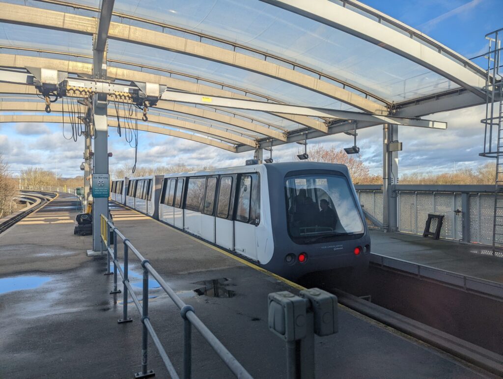 Gatwick Airport terminal shuttle departing the South Terminal on elevated track
