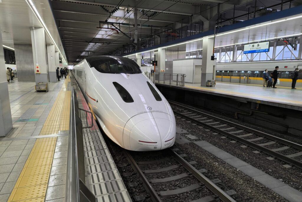 Kyushu Shinkansen 800 series bullet train waiting at a Hakata Station platform