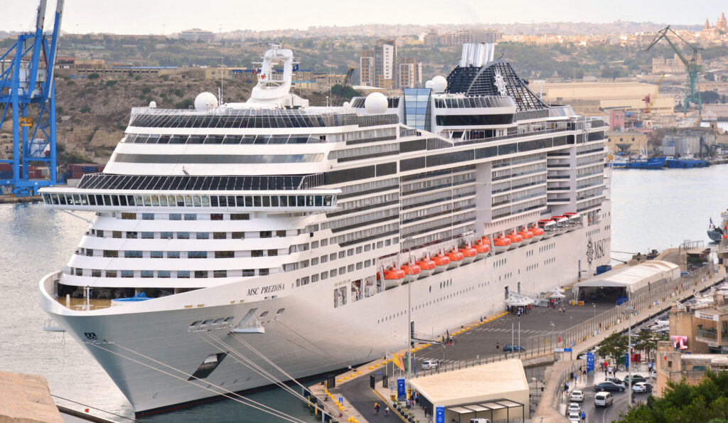 Large modern cruise ship docked at Mediterranean port in Malta