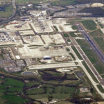 Genius Travels - Advenutre Travel Guides | Aerial view of London Gatwick Airport showing terminals runway and countryside for the gatwick second runway story