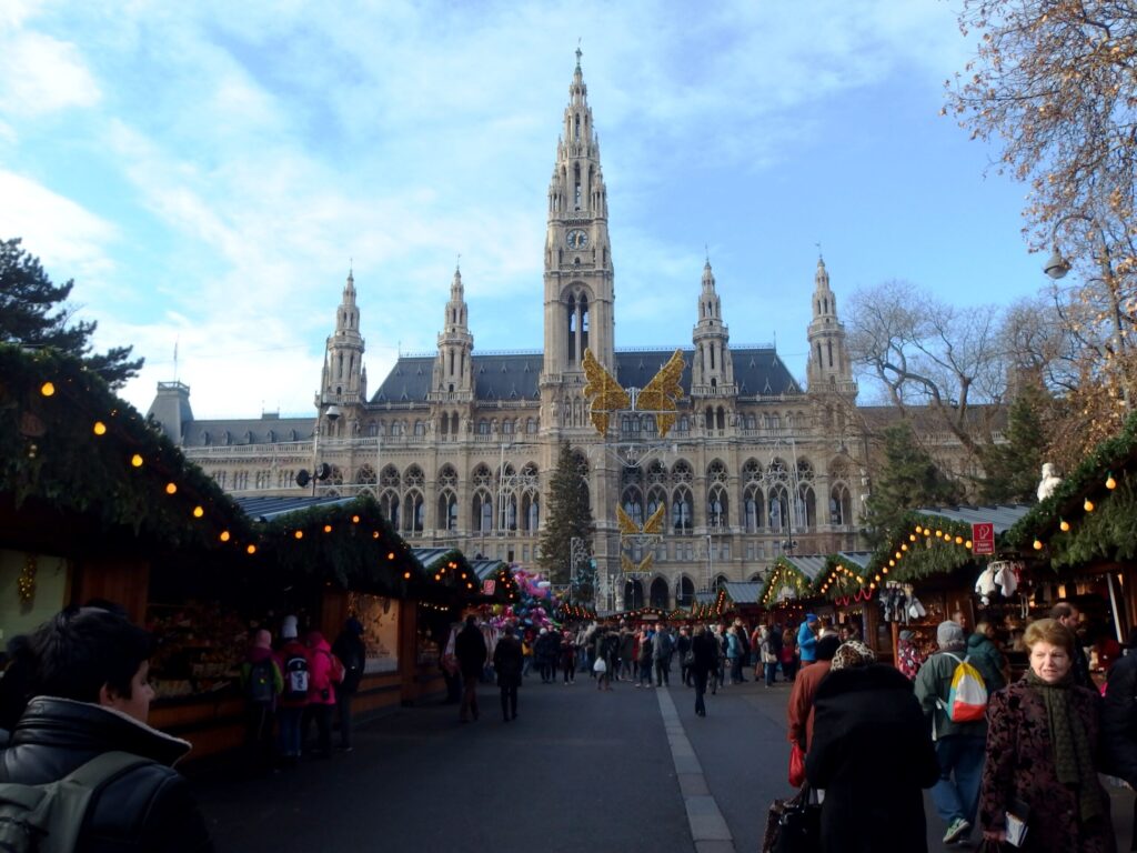 Christkindlmarkt stalls and crowds in front of Vienna City Hall on Rathausplatz