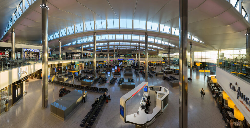 Interior of Heathrow Terminal 2 showing the curved roof and seating areas