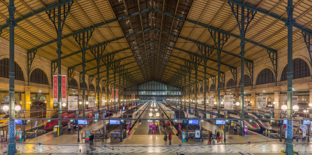 Interior train shed at Paris Gare du Nord looking down the platforms