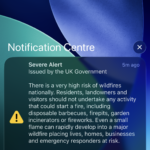 iPhone lock screen showing the UK government severe wildfire alert in English