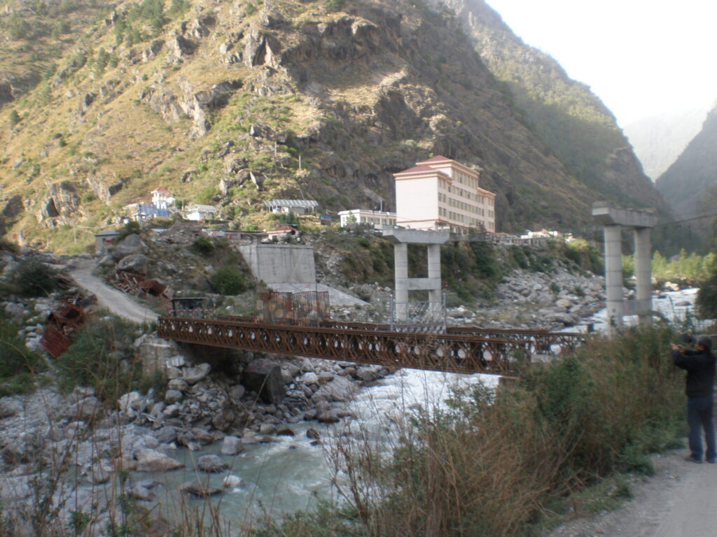 Flash Floods Kill at Least 98 in Nepal and China as Hundreds of Tourists Remain Missing | The Sino-Nepal Friendship Bridge at Rasuwagadhi before the flooding destroyed it
