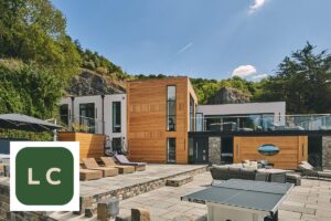 Luxury Cottages logo with discount code offer