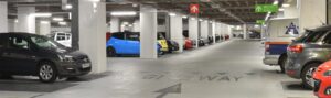 Q-Park logo and car park barrier, discount codes