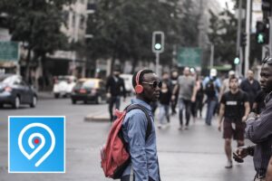 VoiceMap app icon with a city street backdrop, representing self-guided audio walking tours