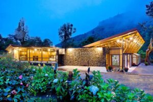 Savegre Hotel logo with Costa Rica cloud forest backdrop