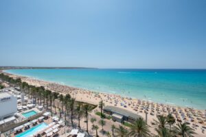 Iberostar Hotels beachfront resort pool and ocean view at sunset