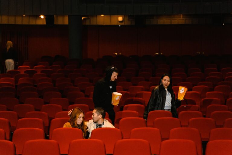 Audience taking their seats in a West End theatre ahead of a show booked through Theatre Tickets Direct