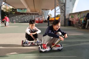Rider using an iHoverboard self-balancing hoverboard outdoors