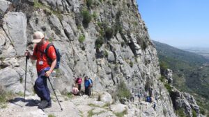 Small group of hikers trekking a mountain trail on an Explore adventure holiday